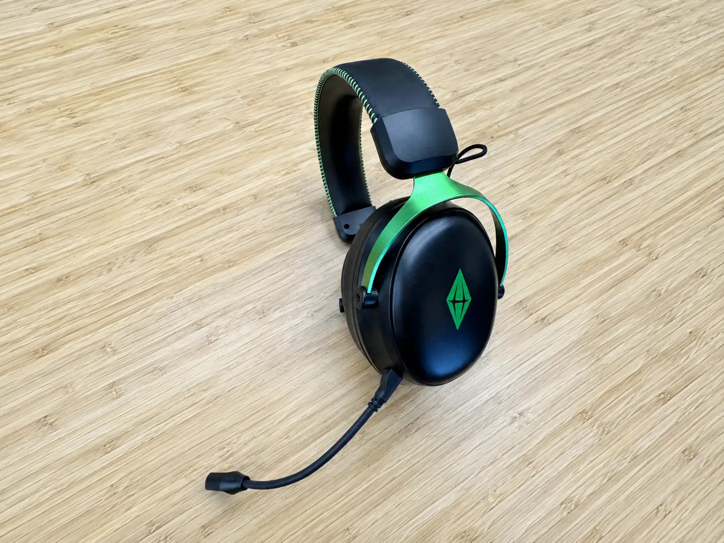 G938 China OEM gaming headset case study green black headset desktop view
