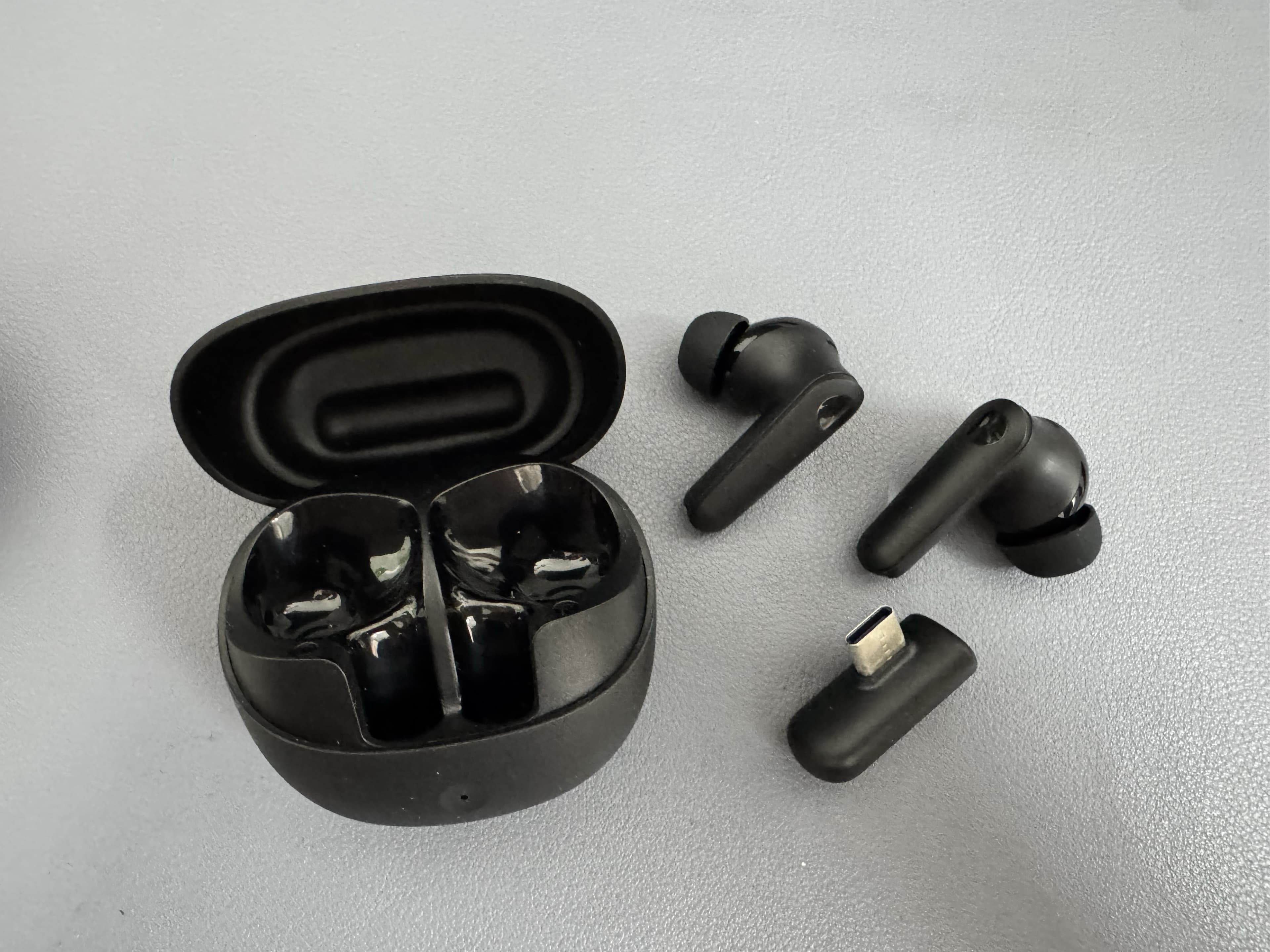 GE3 Korea OEM gaming TWS earbuds case study black earbuds and Type-C dongle detail