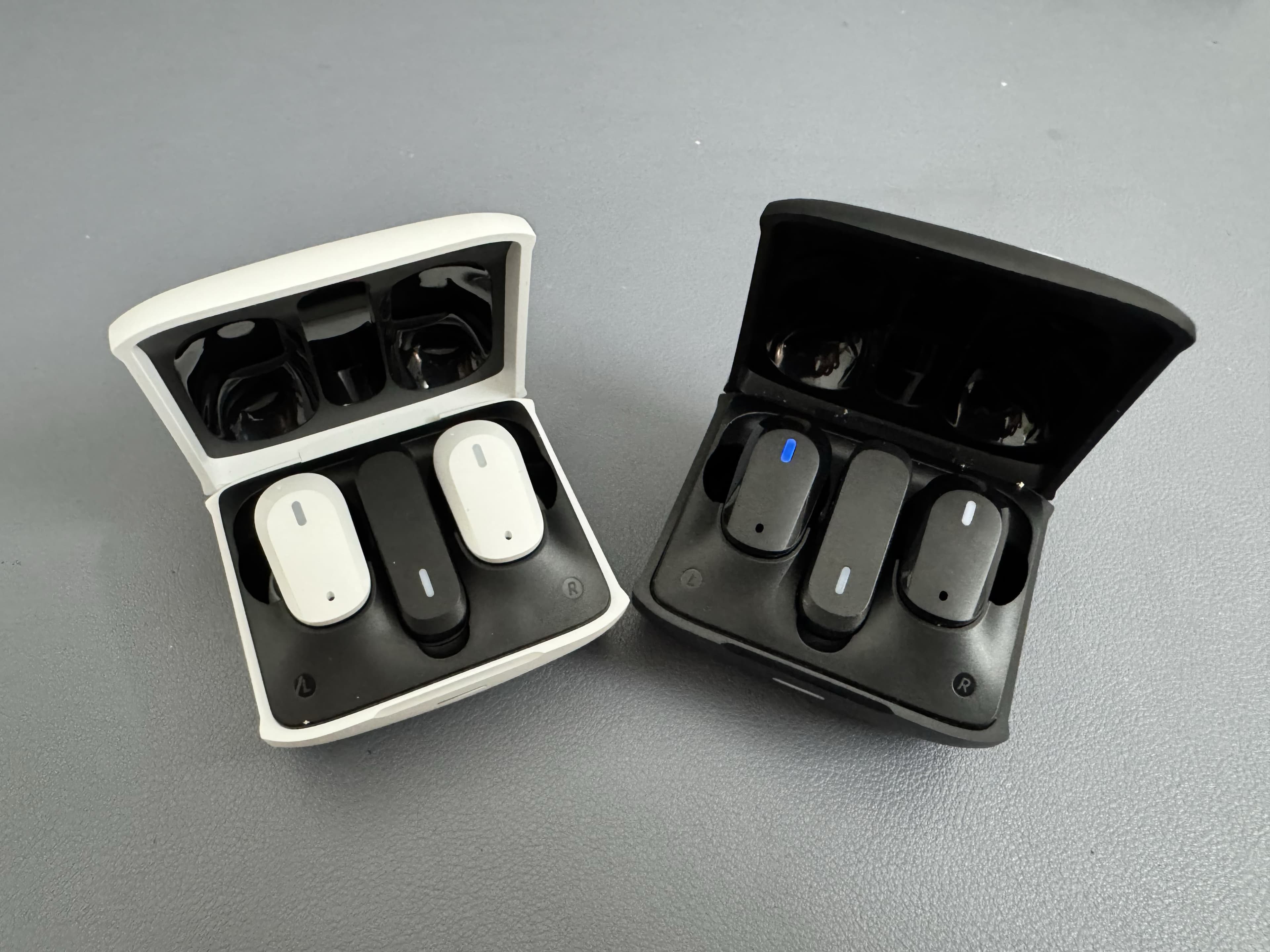 GE5 Korea OEM gaming TWS earbuds case study black and white earbuds charging case view