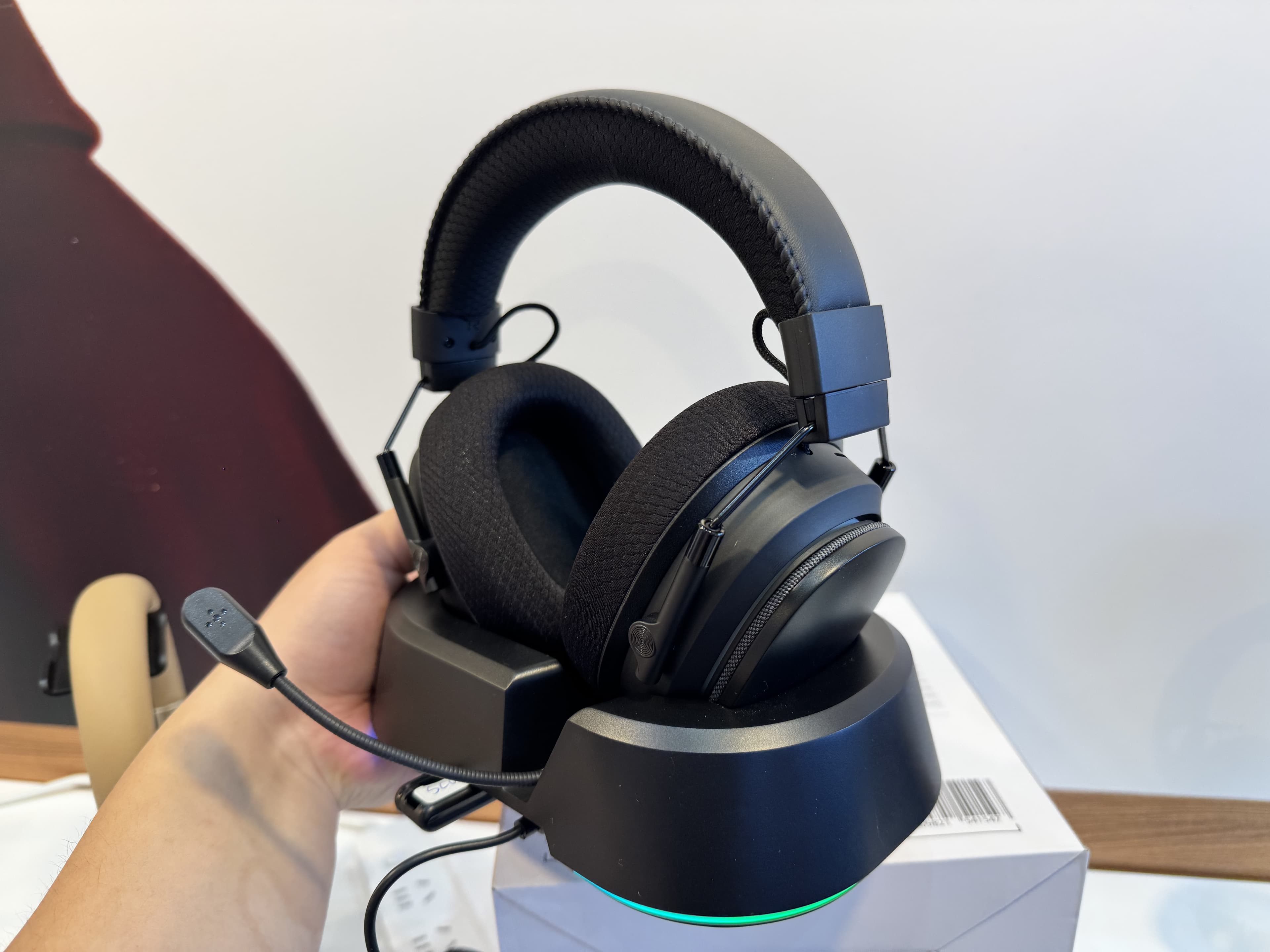 G946 wireless gaming headset sample shown on its charging base during development review