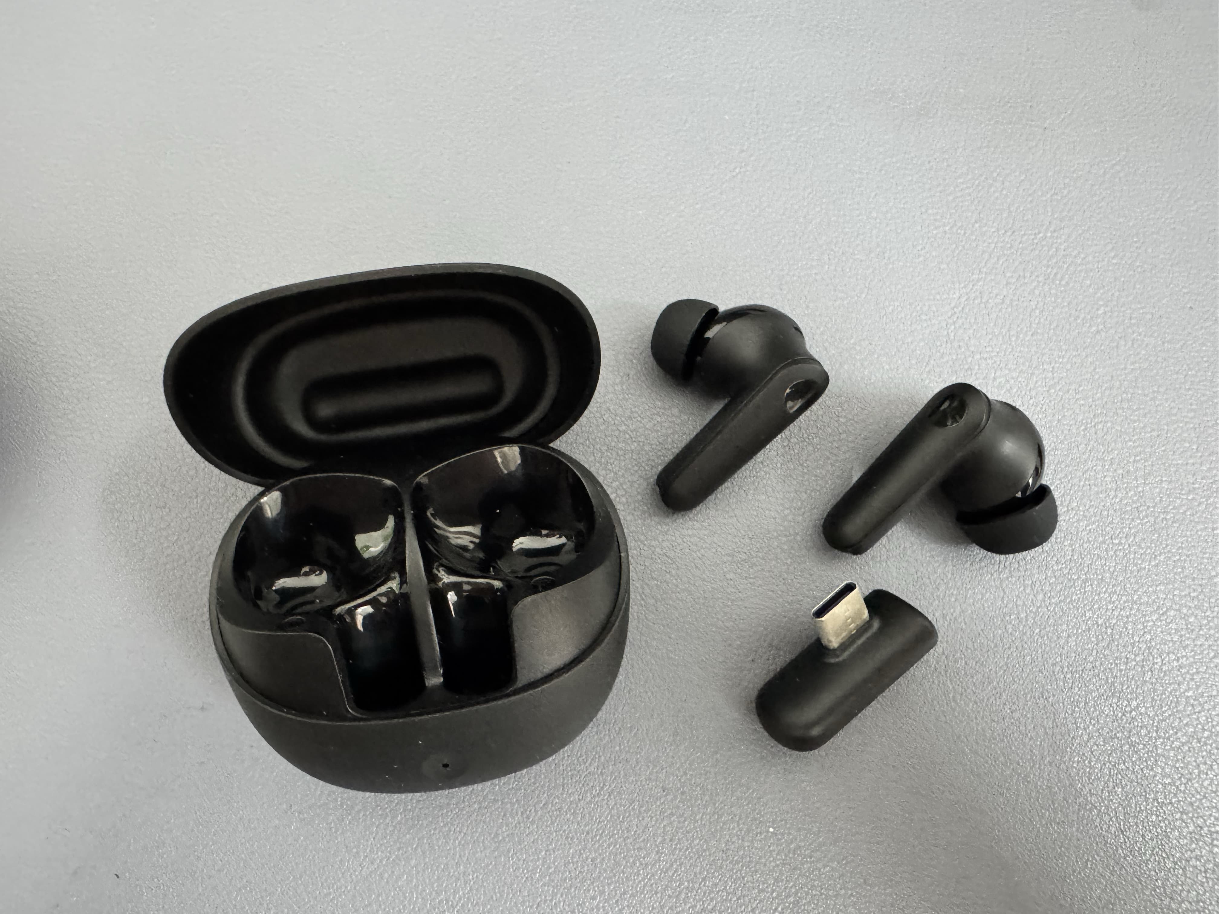 GE3 gaming earbuds and Type-C receiver detail for outgoing quality control